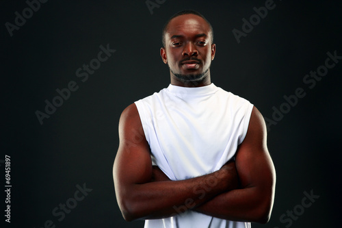 handsome african sports man over black background