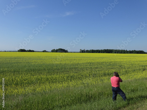 the man photographs in the field