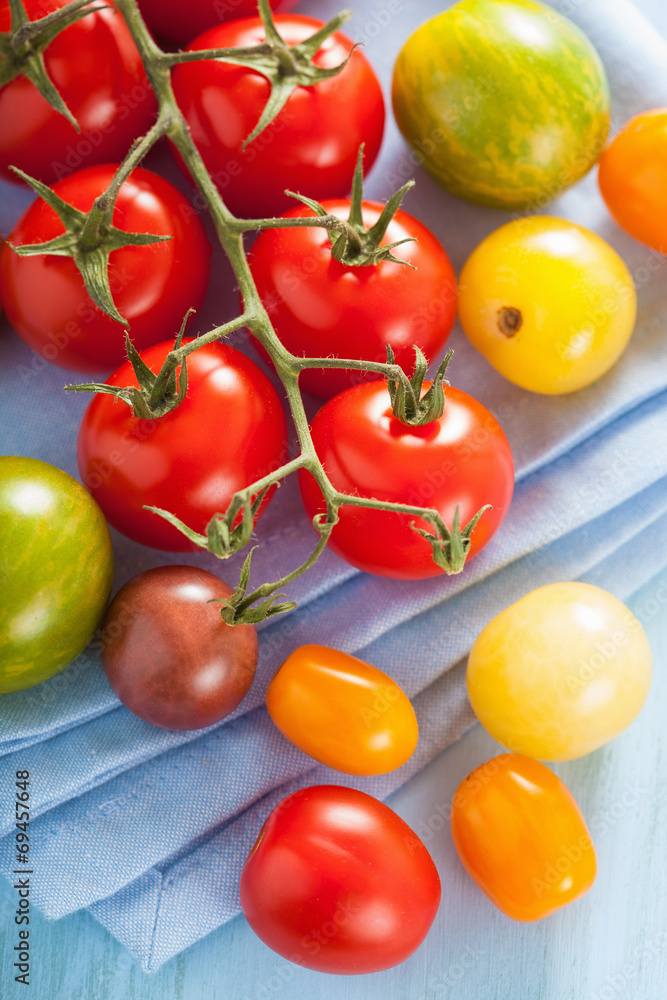 colorful tomatoes over blue napkin