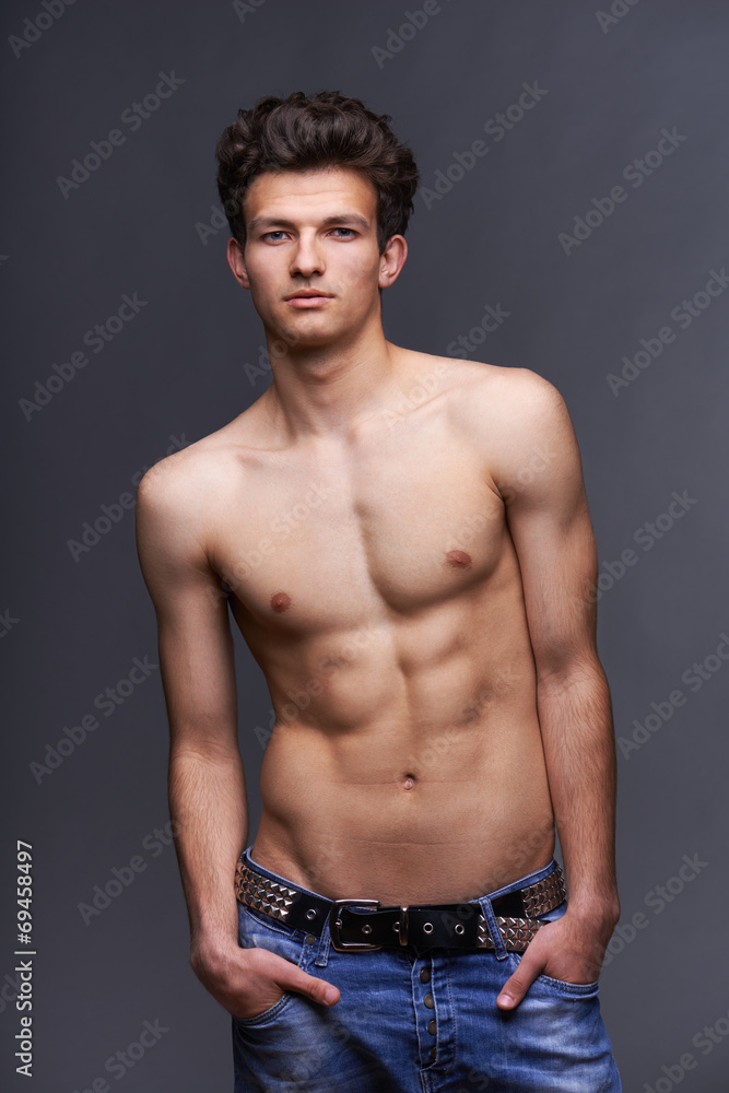 Fototapeta premium Male fashion model with modern haircut