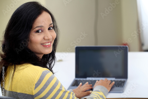 Young female student using tablet computer