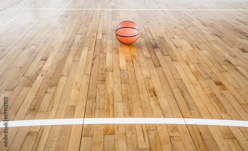 Basketball ball over floor in the gym © torsak