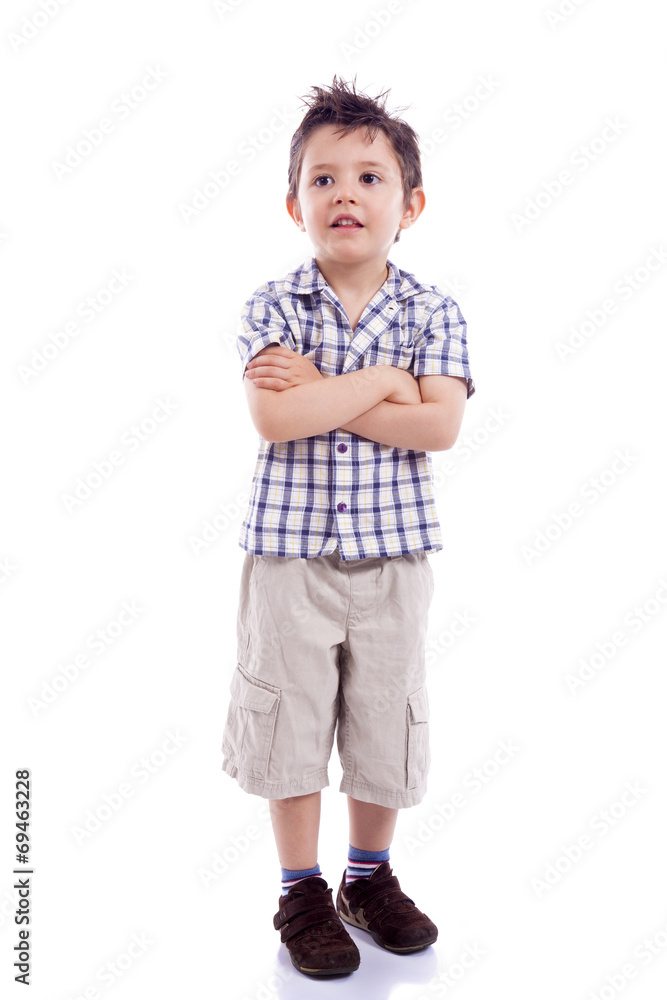 Portrait of beautiful little boy standing with arms crossed on Portrait of beautiful little boy standing with arms crossed on