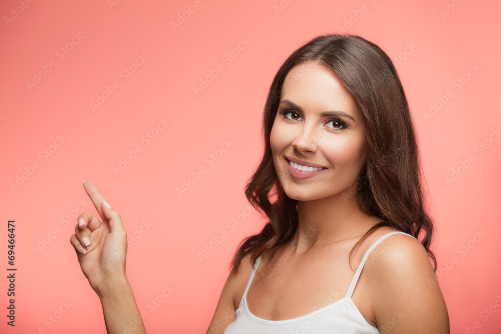 Woman showing copyspace or something, over red Woman showing copyspace or something, over red