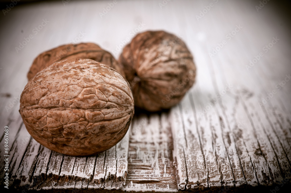 Dried walnuts wooden table Dried walnuts wooden table