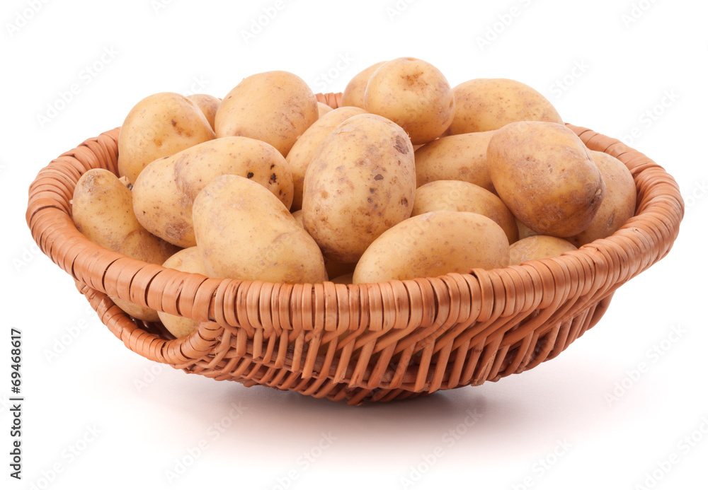Potato tuber in wicker basket isolated on white background Potato tuber in wicker basket isolated on white background
