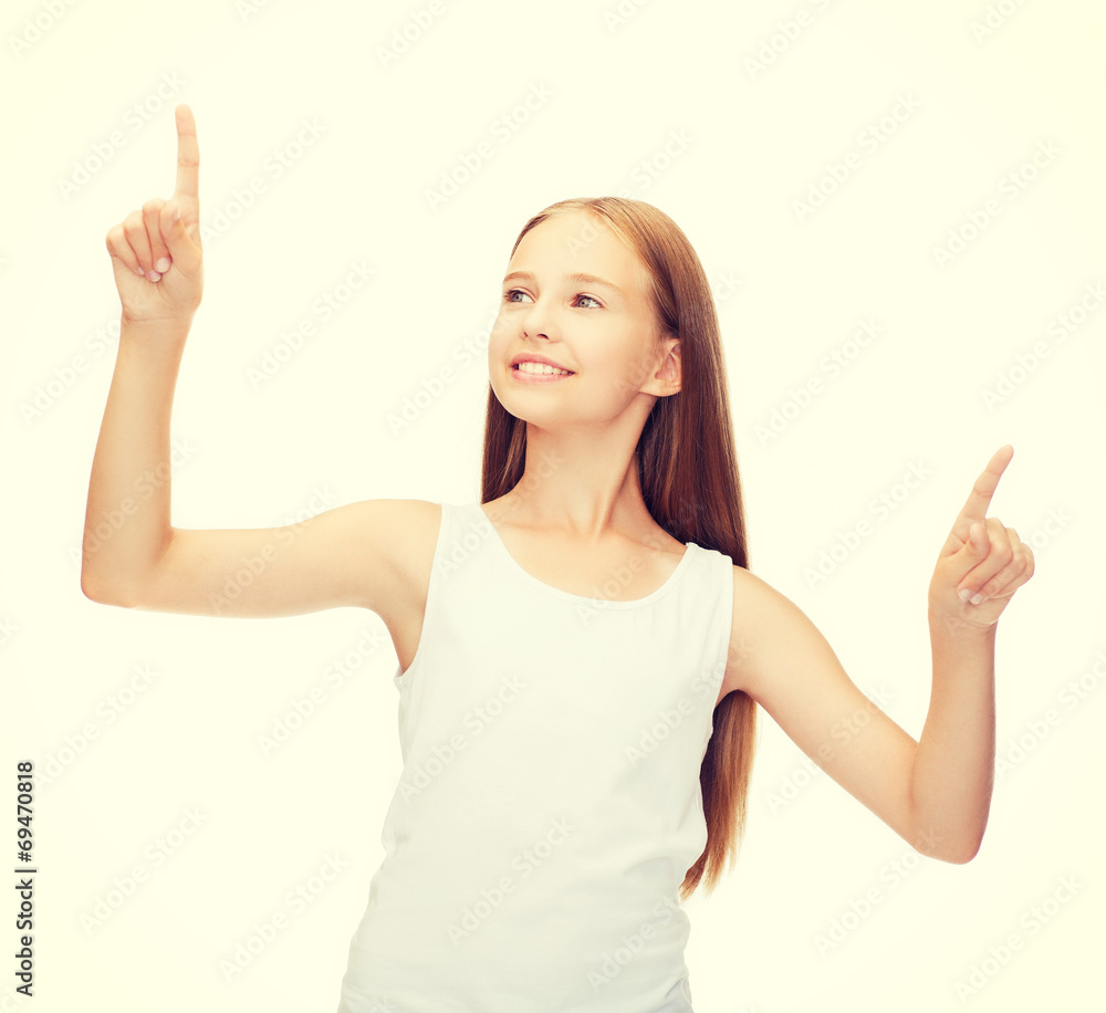 girl in blank white shirt pointing to something girl in blank white shirt pointing to something