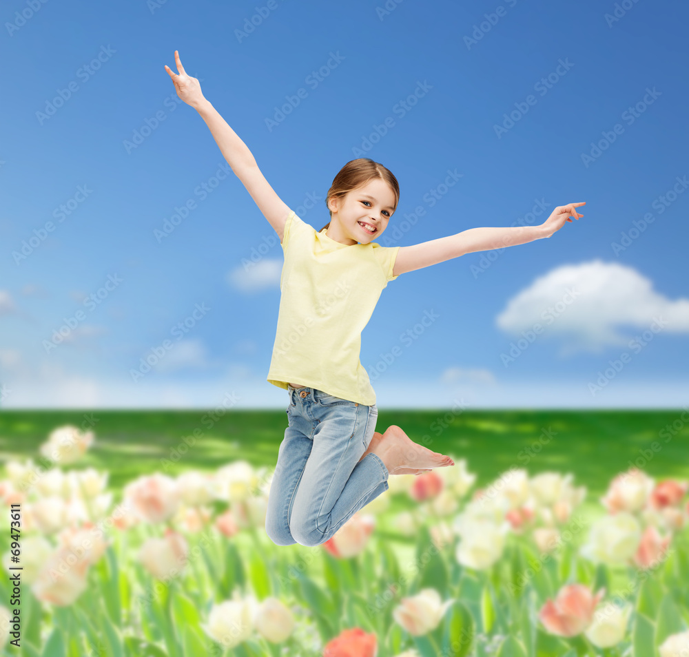 smiling little girl jumping smiling little girl jumping
