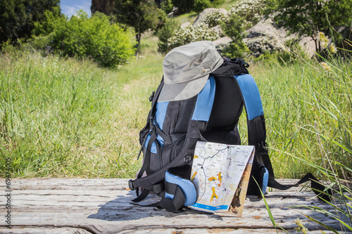 Hiking with bag and accessories for adventure.