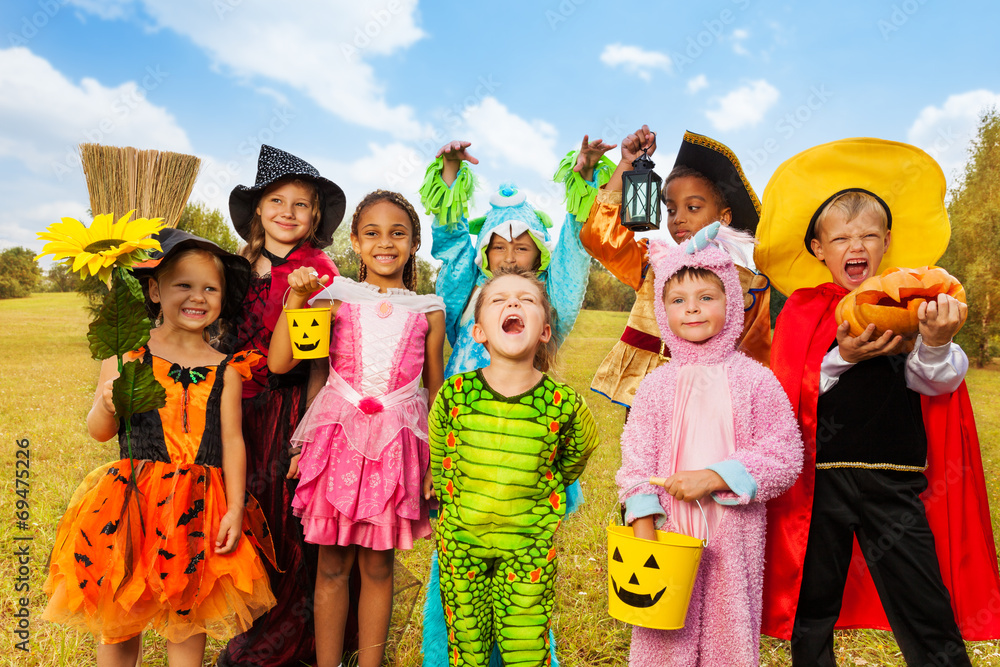 Fototapeta premium Happy excited kids in Halloween costumes