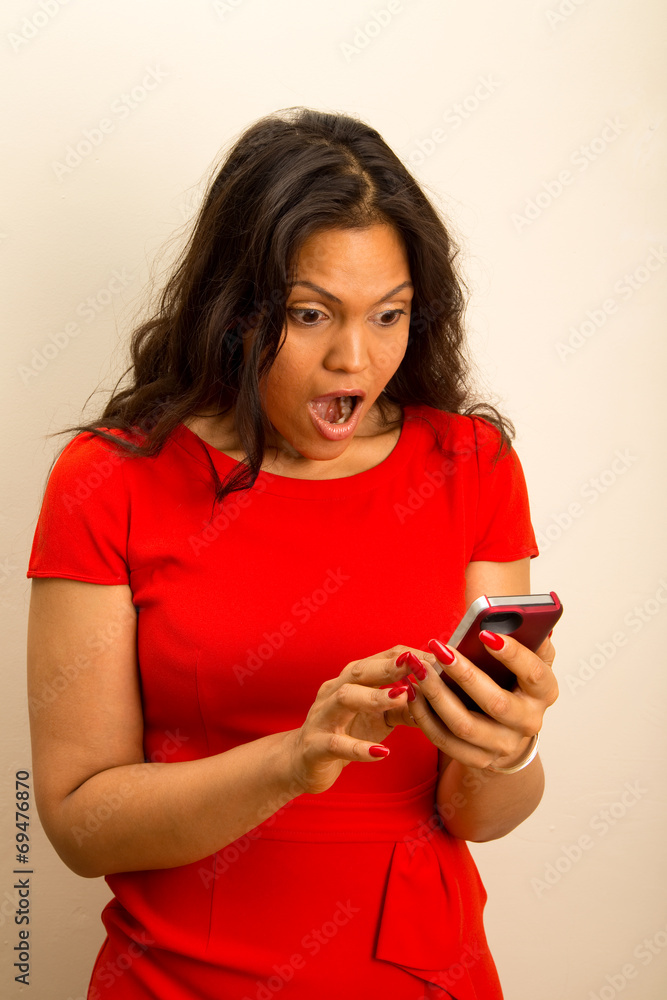 beautiful girl looks shocked at phone beautiful girl looks shocked at phone