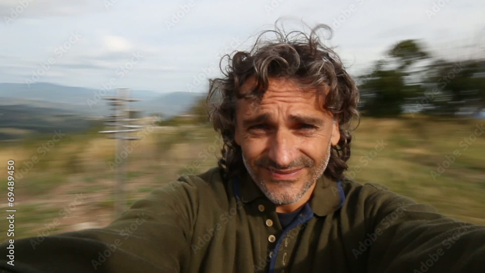 man spinning at the top of a mountain man spinning at the top of a mountain