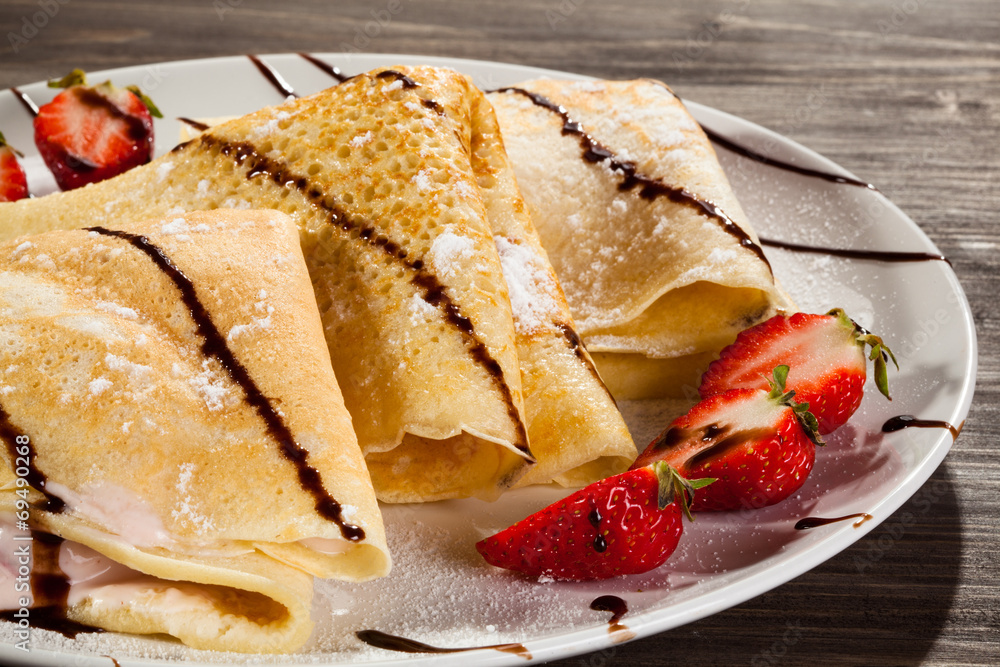 Pancakes with cream and strawberries Pancakes with cream and strawberries