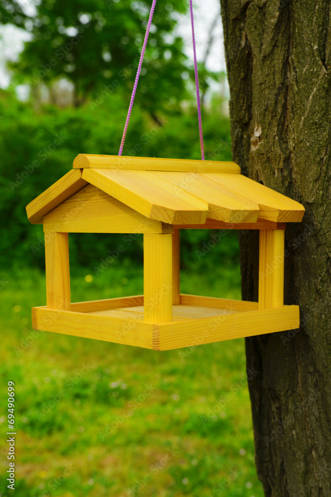 Birdhouse in garden outdoors