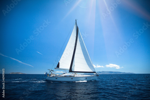 Yacht in the bright sunlight. Luxury yachts.