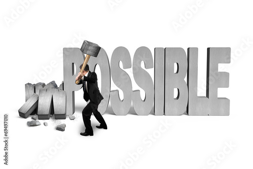 man holding hammer to crack impossible 3D concrete word photo