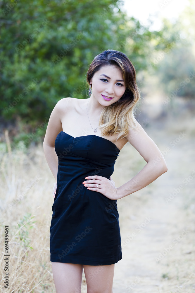 Asian American Woman Black Dress Outdoors Skinny Asian American Woman Black Dress Outdoors Skinny