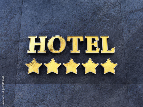 Golden 5 star Hotel sign on a wall , Luxury Hotel