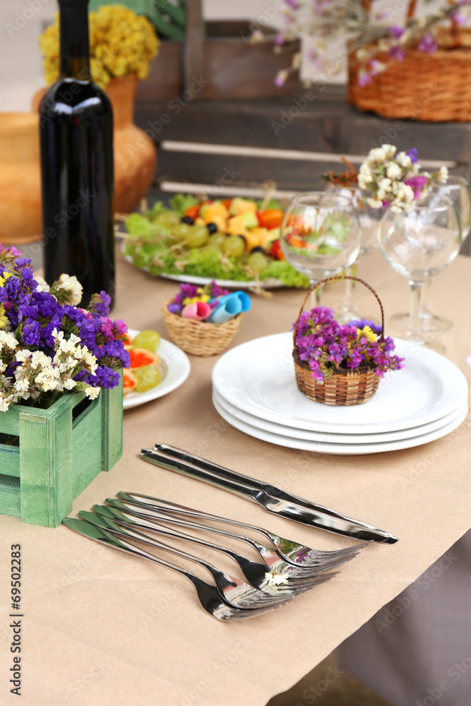 Buffet table with dishware waiting for guests Buffet table with dishware waiting for guests