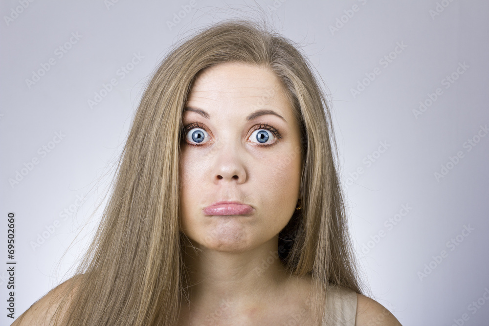 Cheerful young girl in surprise Cheerful young girl in surprise