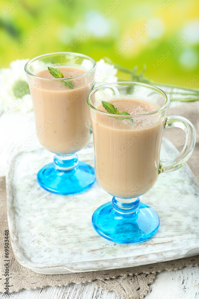 Delicious berry mousse in glasses on table on bright background Delicious berry mousse in glasses on table on bright background