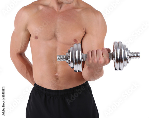 Young muscular sportsman execute exercise with dumbbell