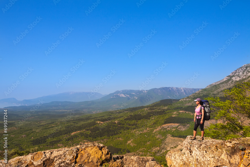 woman on top of the rock