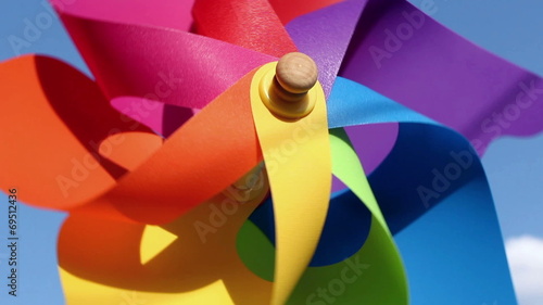 Colorful pinwheel toy against blue sky photo