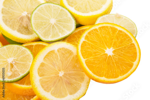 Lime, lemon and orange layer slices over white background