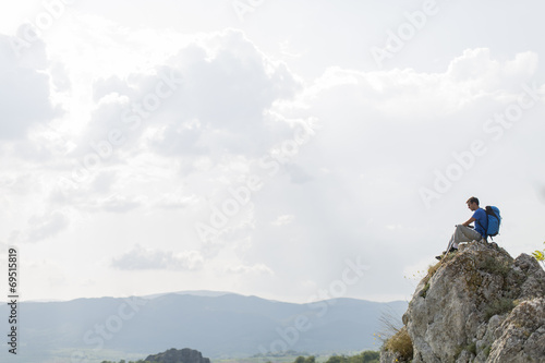 Young man hiking on the mountain