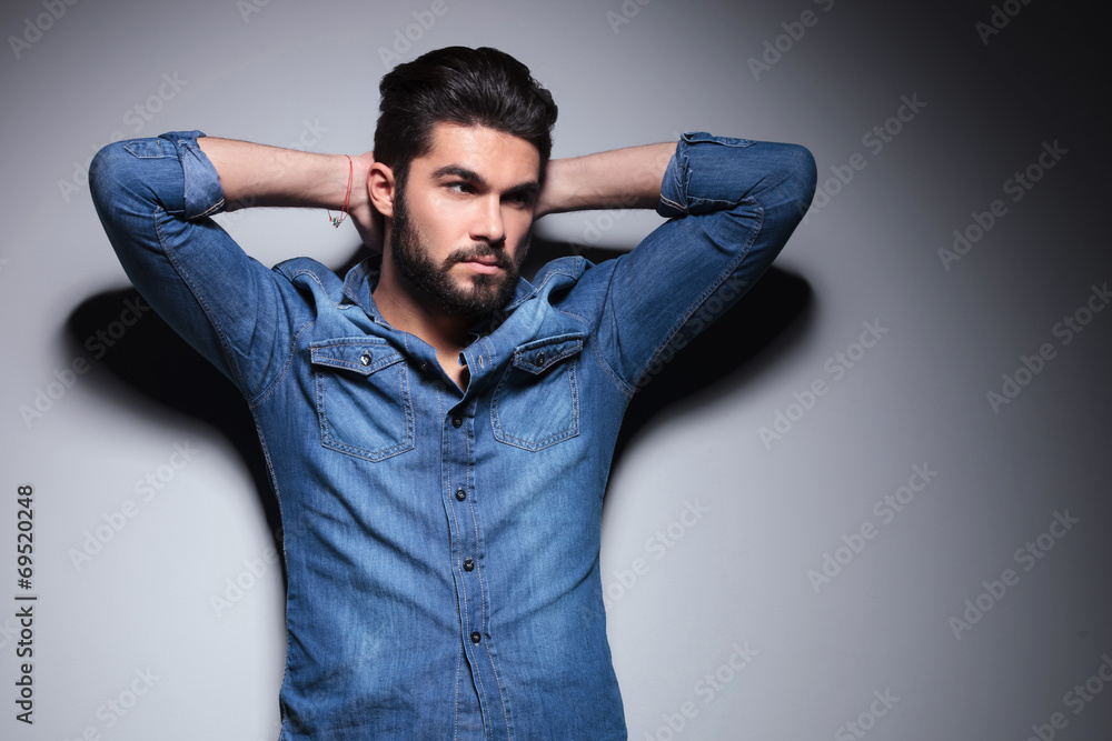 Man with hand behind his head Man with hand behind his head
