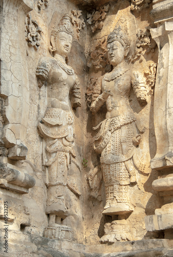 decorated wall with a mythological figure in a Buddhist temple
