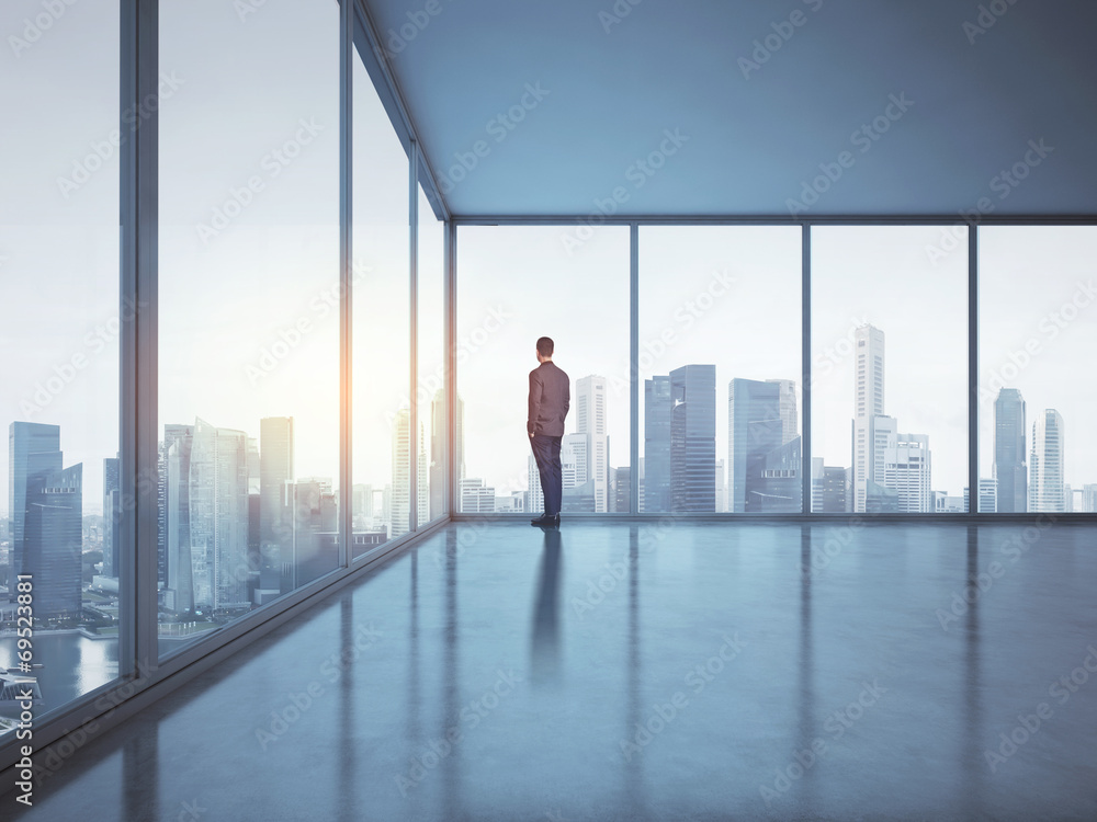 business man looking megalopolis through window business man looking megalopolis through window