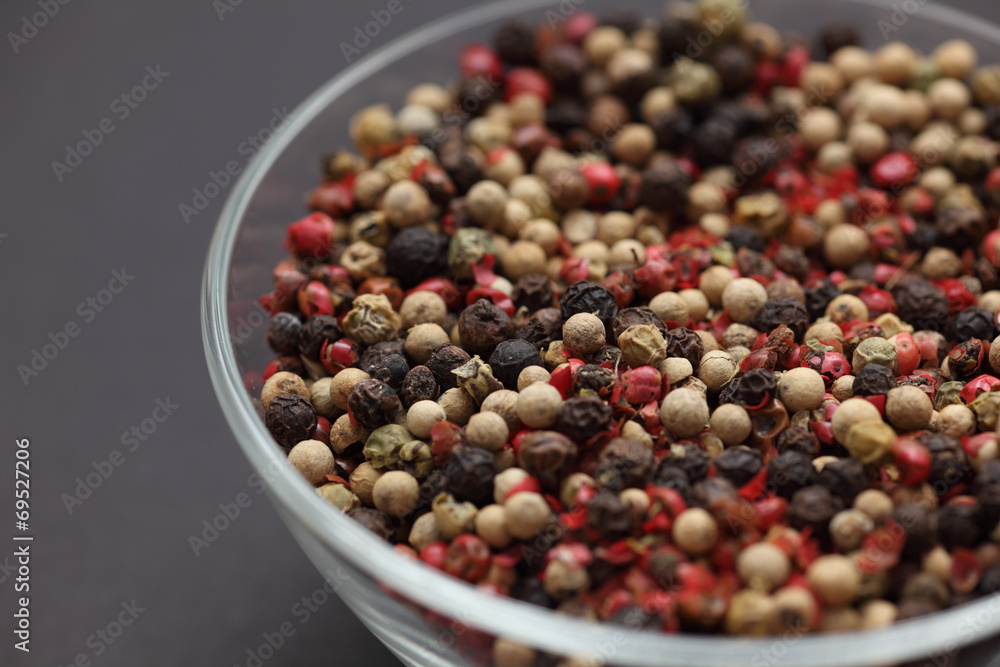 Mixed peppercorns in a glass bowl Mixed peppercorns in a glass bowl