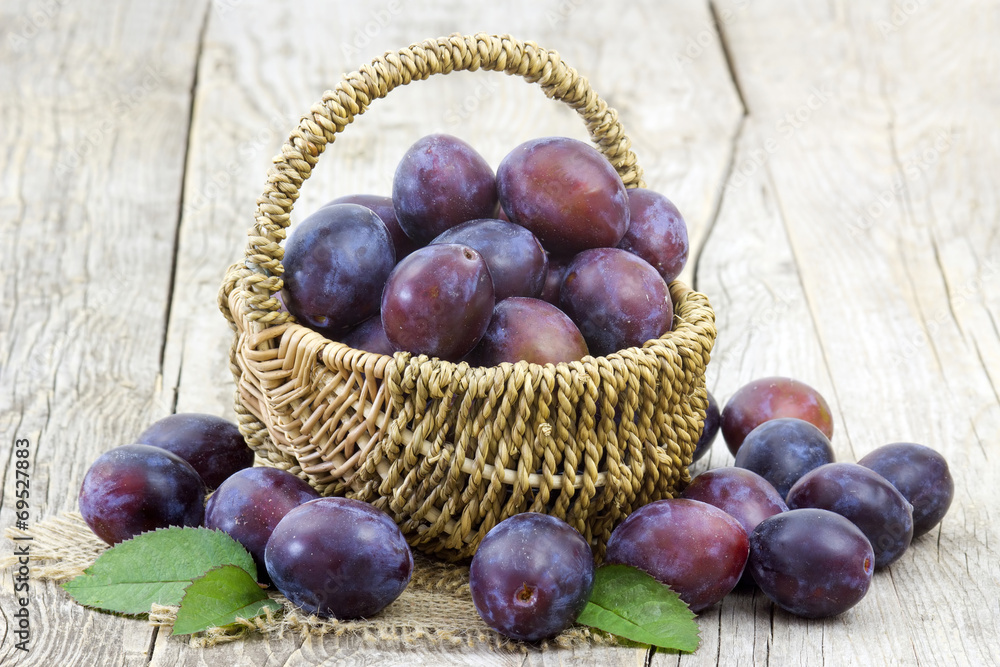 fresh plums in a basket