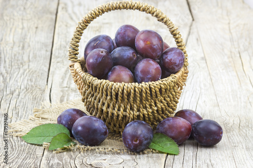 fresh plums in a basket