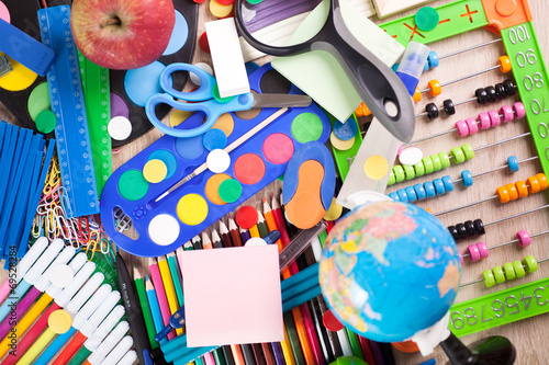 Full background of a colorful assortment of school supplies photo