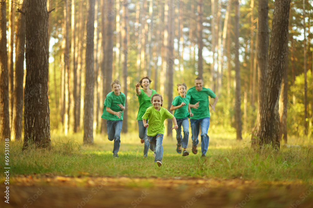 Happy cheerful family running