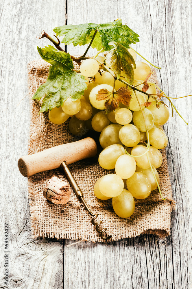 Bunch of white grape in rustic setting