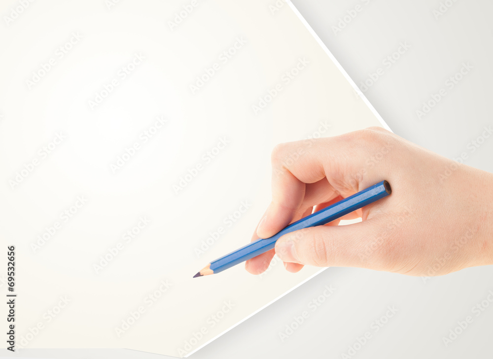 Human hand drawing with pencil on empty paper template Human hand drawing with pencil on empty paper template