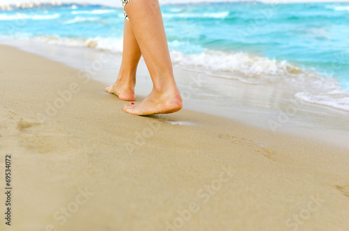 Woman walking on the beach