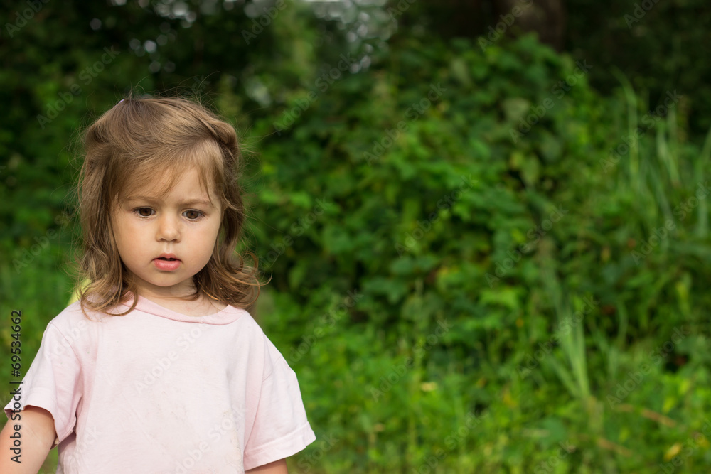 thoughtful little girl green background thoughtful little girl green background