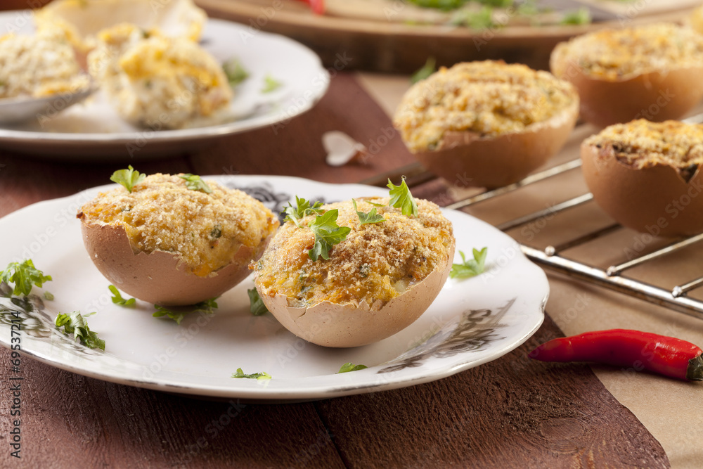 Baked eggs, stuffed with ham and parsley Baked eggs, stuffed with ham and parsley