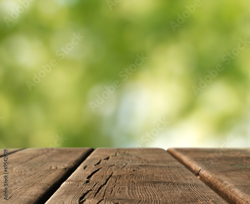 wooden table in country landscape