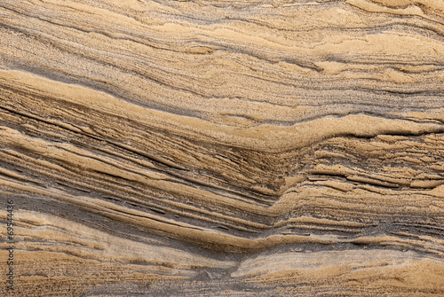 Fotografie texture of golden lines of loose rock