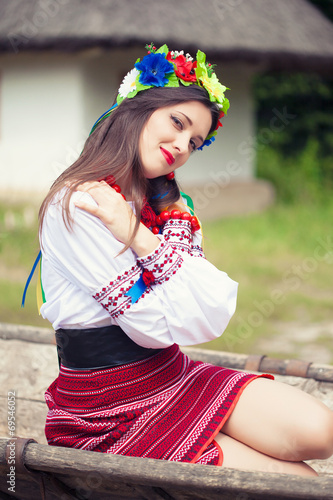 beautiful young woman wearing national ukrainian clothes posing