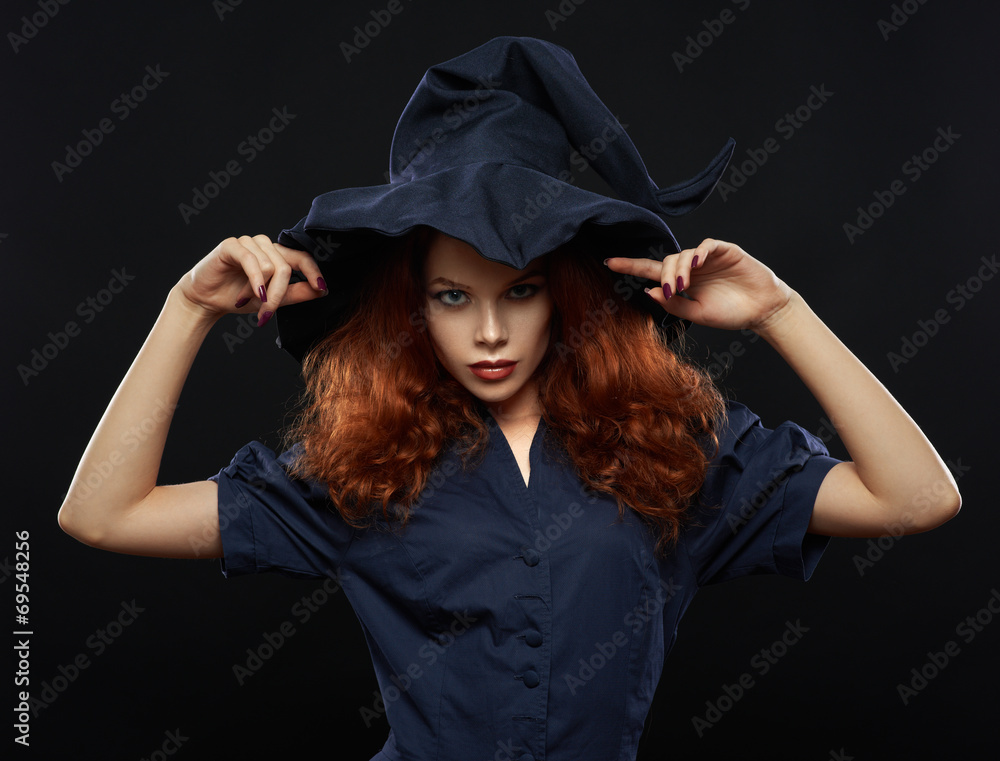 beautiful red-haired girl in a costume witch beautiful red-haired girl in a costume witch