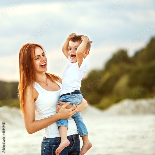 happy mother and son in the mountains playing