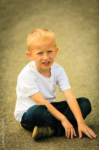  Little thoughtful boy child portrait outdoor