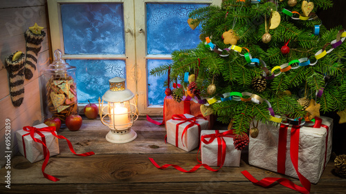 Christmas eve in warm and cozy rustic cottage